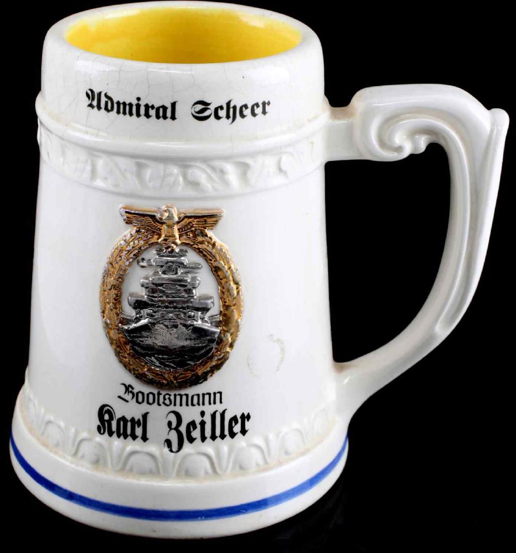 WWII GERMAN KRIEGSMARINE ADMIRAL SCHEER BEER MUG: Cruiser Admiral Scheer, mug named to Bootmann Karl Zeiller below High Seas badge, Hamburg stamped base, light crazing, stands 5.5 inches. MA913