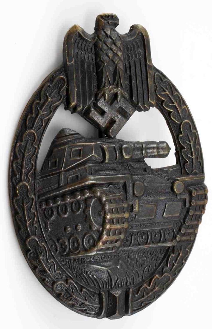 WWII GERMAN 3RD REICH BRONZE PANZER ASSAULT BADGE: Bronze grade, stamp construction. Thin pin-back design on unmarked reverse. Excellent condition with slight patina present. Great example. This lot has a reserve.