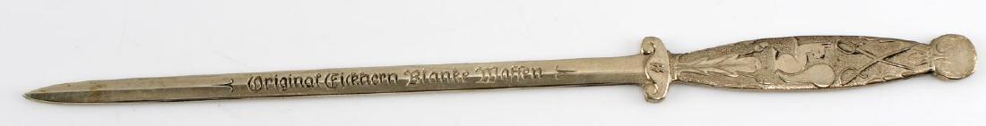 WWII GERMAN THIRD REICH EIKHORN SS LETTER OPENER: "Original Eikhorn Blanke Waffen" etched letter opener with double sig SS runes, swastika, and squirrel Eikhorn trademark. Very good condition overall. This lot has a reserve.