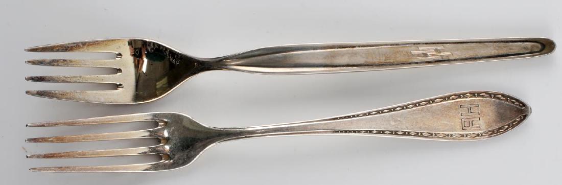 WWII GERMAN ADOLF HITLER PERSONAL SILVERWARE: This lot features 2 Adolf Hitler "A H" monogrammed forks from his personal collection. 1 reverse is stamped Wellner Silber SWS with elephant mark. The other is marked WMF with pattern number 90-45. 7.