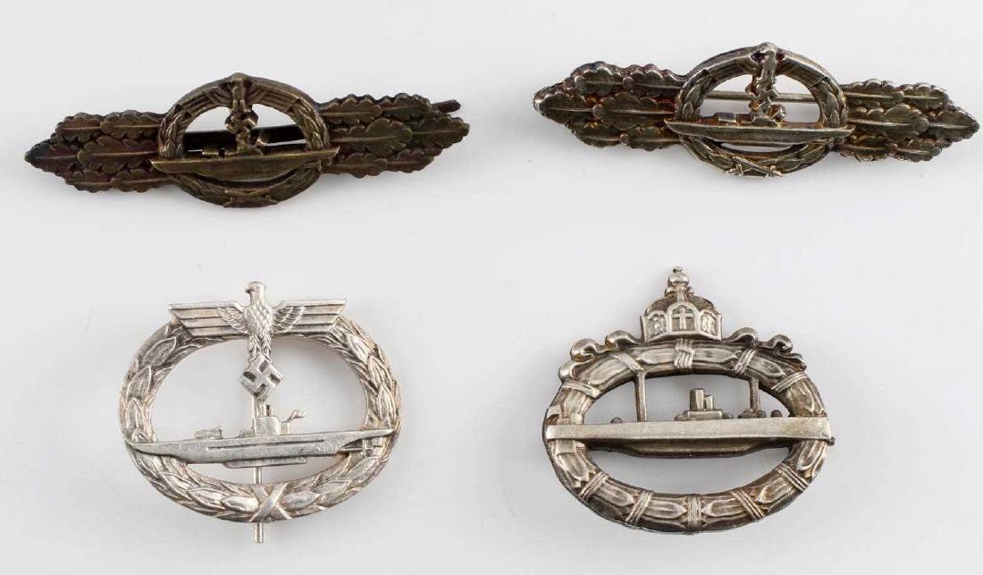 WWI WWII GERMAN NAVAL U BOAT BADGE LOT OF FOUR: Four German U-Boat crew badges. One is a WWI U-Boat badge. The second is a WWII Kriegsmarine U-Boat badge. The last two are a silver and a bronze edition of the WWII U-Boat clasp. Each badge has a mak