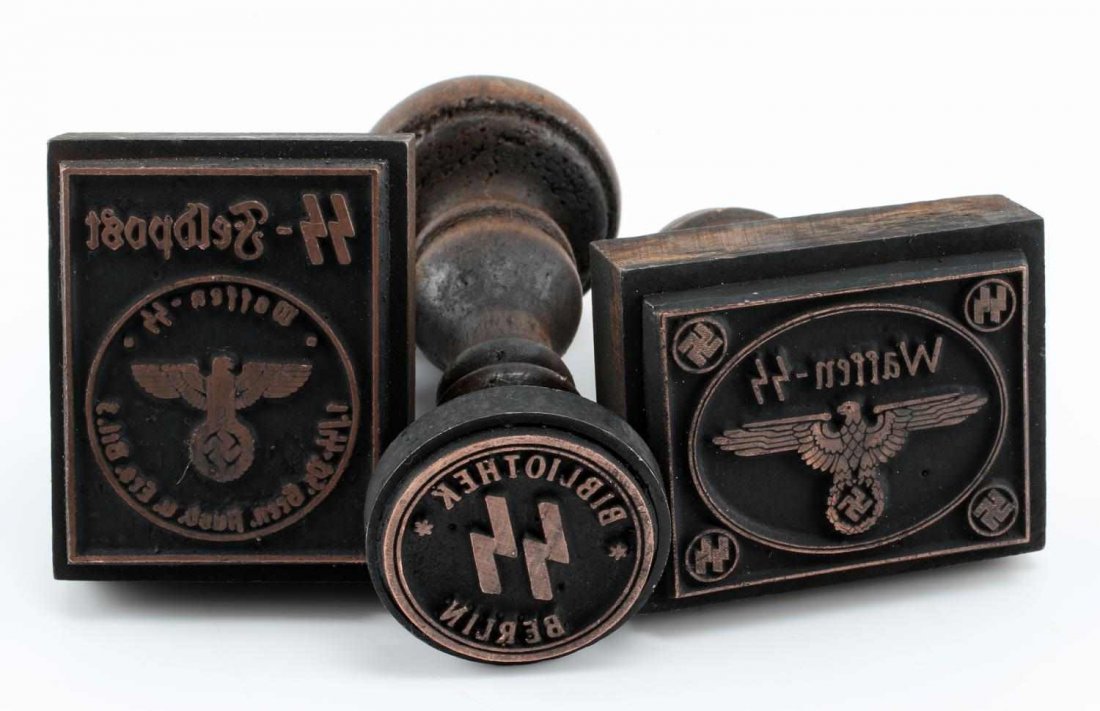 WWII GERMAN THIRD REICH WAFFEN SS HAND STAMP LOT: Lot of three wooden hand stamps. One 'Waffen SS', one 'Berlin Library', and one SS field post. All are in very good condition. Unauthenticated/Sold 'as is' This lot has a reserve.