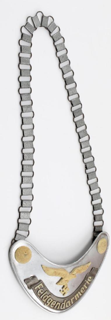 GERMAN THIRD REICH LUFTWAFFE FELDGENDARME GORGET: Luftwaffe Feldgendarmerie gorget. In very good condition. Has Luftwaffe mark on the back hook. In very good condition. Unauthenticated/Sold 'as is' This lot has a reserve.