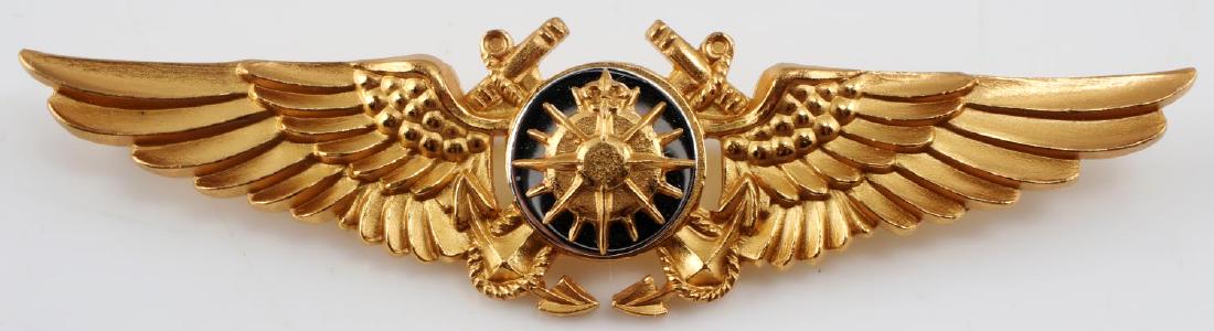 USN WWII NAVAL AVIATOR NAVIGATOR WING BADGE: USN WWII Naval Aviator Navigator Wing. Measures 2 3/4 inches wide by 11/16 inch tall. Reverse is maker marked "NS Meyer Inc New York". Brass and nickel construction. Very good condition.