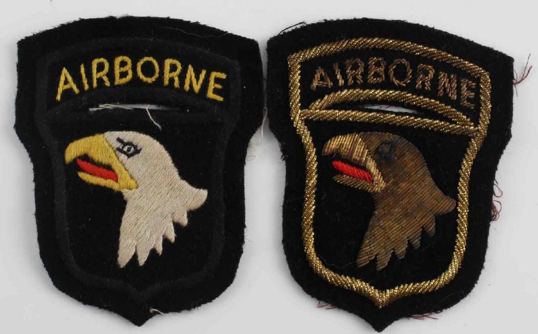 US VIETNAM ARMY 101ST AIRBORNE PARATROOPER PATCHES: Both showing screaming eagle with 'Airborne' on the rocker above. Measure 3 inches wide and 3 7/8 inches tall. One is hand and machine embroidered cotton on wool backing. The other is hand and machine