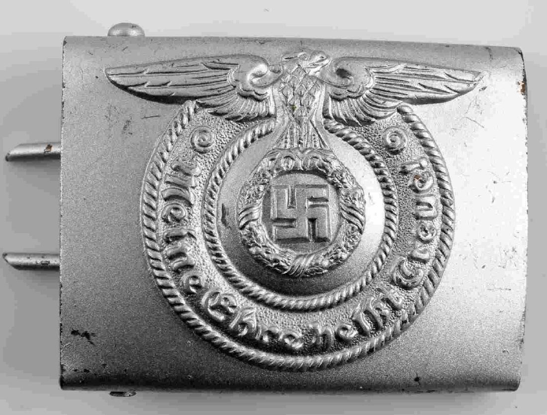 WWII GERMAN WAFFEN SS ENLISTED BELT BUCKLE: WWII German SS Belt buckle. Reichsadler/swastika/wreath and "Meine Ehre Heisst Treue!" (My honor is loyalty) obverse. The reverse side is maker marked "RODD". Aluminum construction. Very good conditio