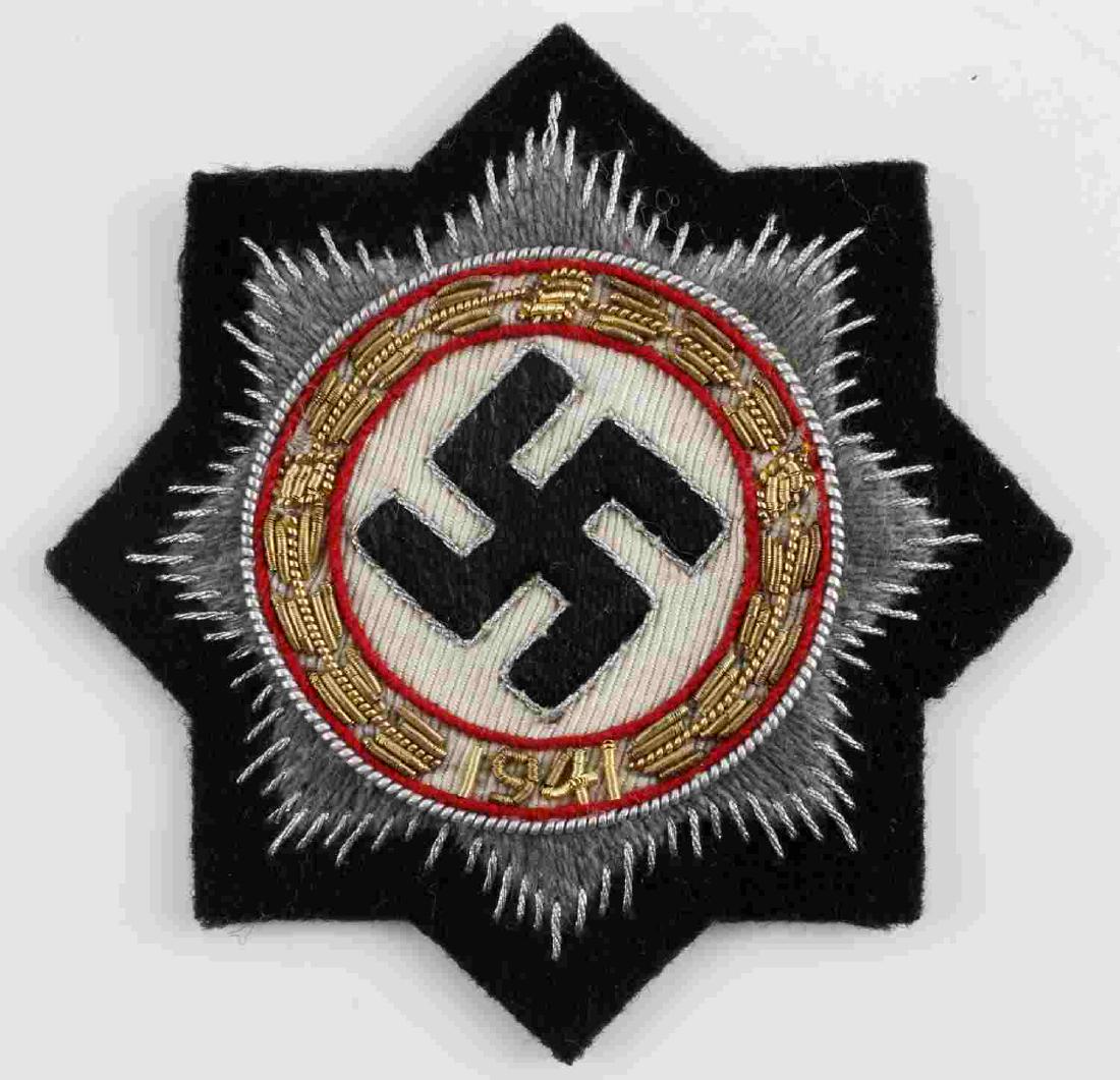 WWII GERMAN WAR ORDER OF GERMAN CROSS PATCH: Waffen SS or Panzer Heer cloth with German Cross in gold. Swastika in center surrounded by a round wreath dated "1941." Eight rays form the edges. Silver and gold bullion wire machine embroidered on b