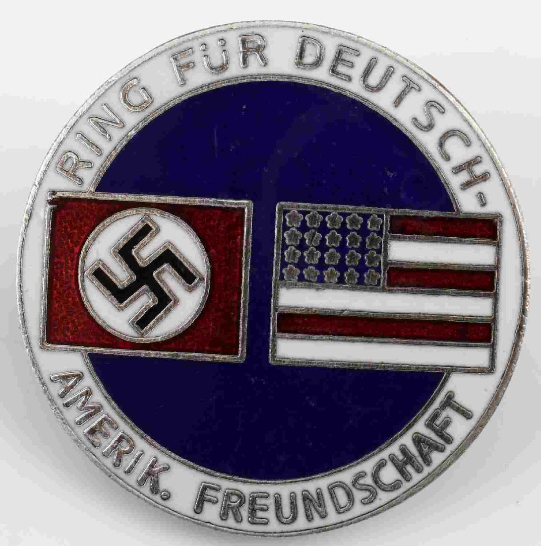 GERMAN WWII THIRD REICH GERMAN AMERICAN BUND BADGE: WWII Third Reich German American Bund membership badge pin. Measures about 1 inch in diameter. Reverse is maker marked "C.T.D.". Nickel and enamel construction. Very good condition.