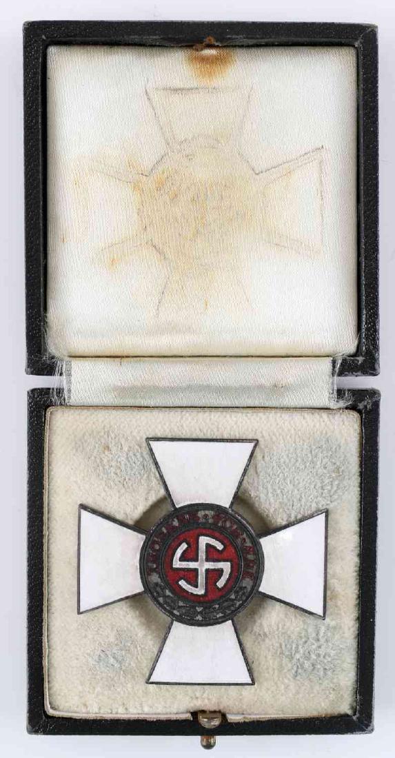 GERMAN WWII THIRD REICH FIRST CLASS CROSS IN BOX: German WII Third Reich Denmark First class Schalburg cross in box. Measures about 1 inch tall by 1 inch wide. One piece nickel construction. Very good condition. Unauthenticated; sold as is.