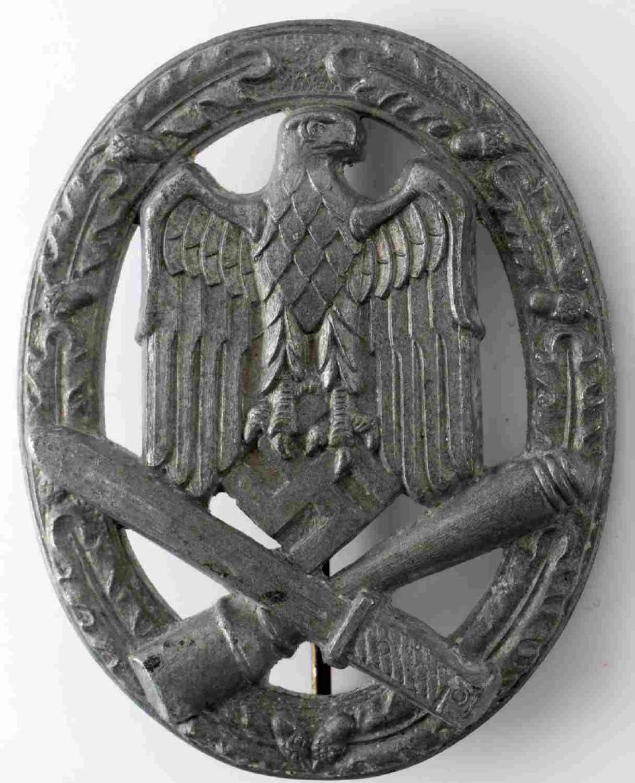 GERMAN THIRD REICH WWII ARMY GENERAL ASSAULT BADGE: German World War II army silver general assault badge. The front shows a German eagle in the center with a crossed grenade and bayonet below. All three are surrounded by an oval oak leaf wreath. The r