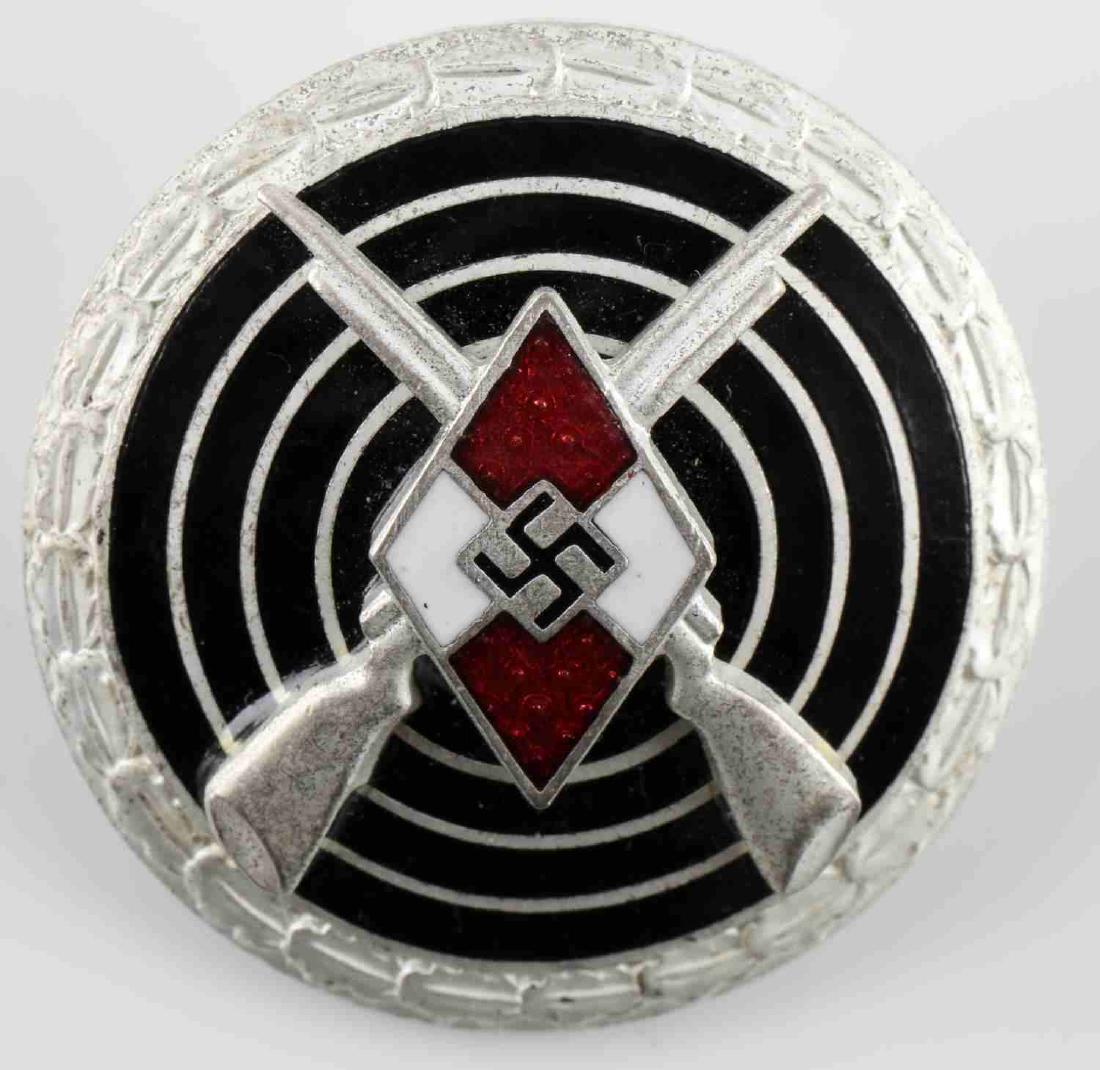 GERMAN WWII HITLER YOUTH HJ MARKSMAN SHOOT BADGE: Senior Marksman Shooting badge. Hitler youth diamond with crossed rifles behind, mounted onto a bulls eye surrounded by oak leaf wreath. Reverse marked 'M1/102.' Thin horizontal safety pin back. Two p