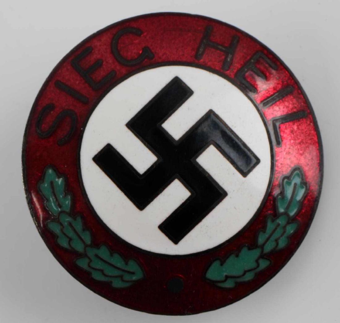 WWII GERMAN SIEG HEIL SWASTIKA BREAST BADGE: German Sieg Heil Swastika Breast Badge. Centered swastika with oak leaf and "Sieg Heil" borders. Screw mount post and nut on reverse. Nickel construction with enamel. Excellent with great enamel. Some