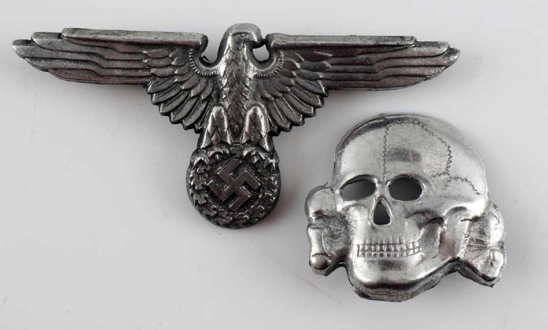 THIRD REICH WWII WAFFEN SS CAP AND EAGLE SKULL: German WWII Waffen SS visor cap eagle and skull. The eagle is maker marked 'RZM SS 499 M1/72' The skull is maker marked 'RZM 499/41' Both have two flat brass horizontal prongs crimped in place on the 
