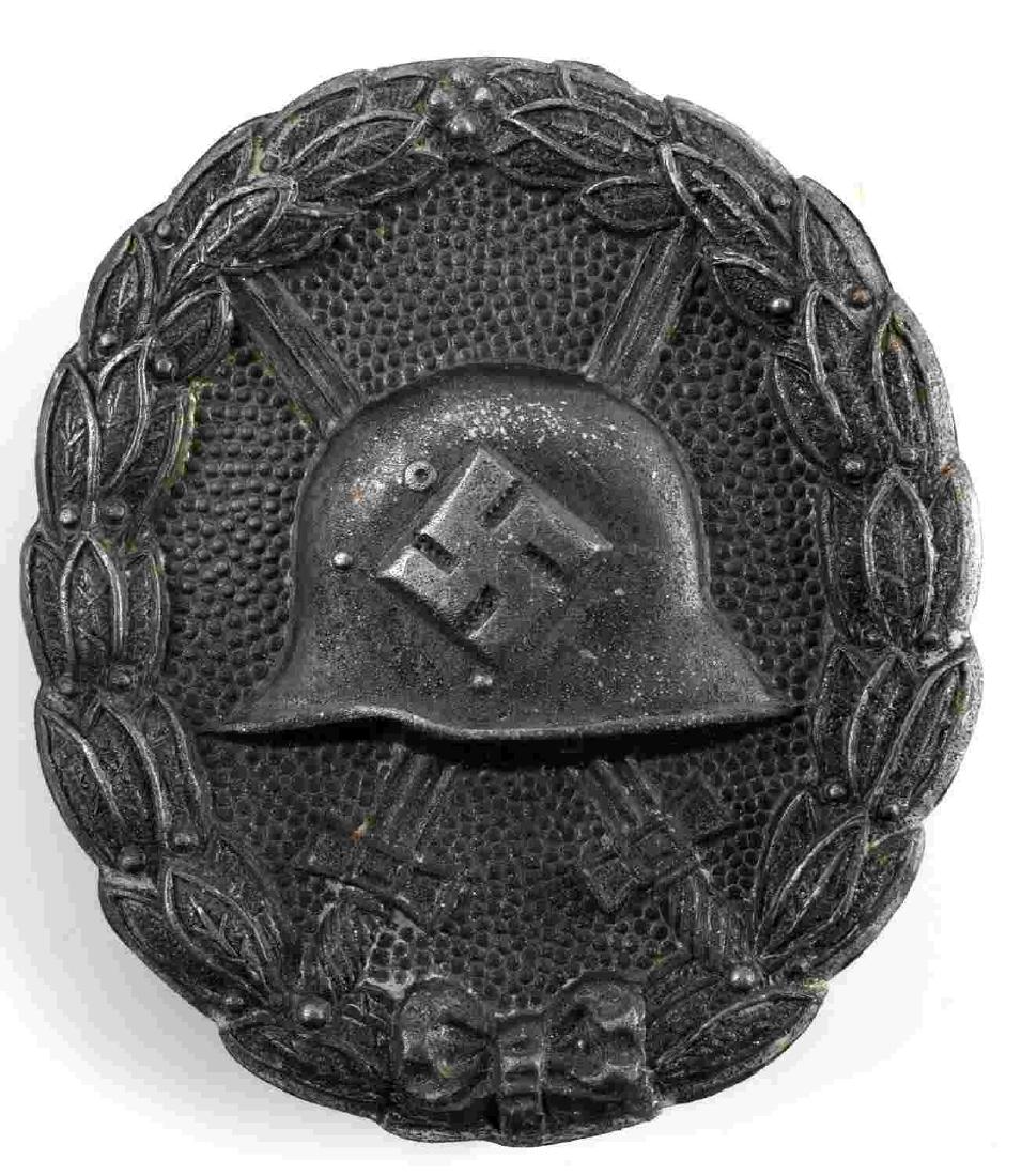 GERMAN WWII SPANISH CONDOR LEGION WOUND BADGE: German Condor Legion Wound Badge in silver. Reverse marked "50". Has a thin vertical pin back with a "C" catch. Solid nickel construction. Awarded for receiving 3-4 wounds during the Spanish Civil War