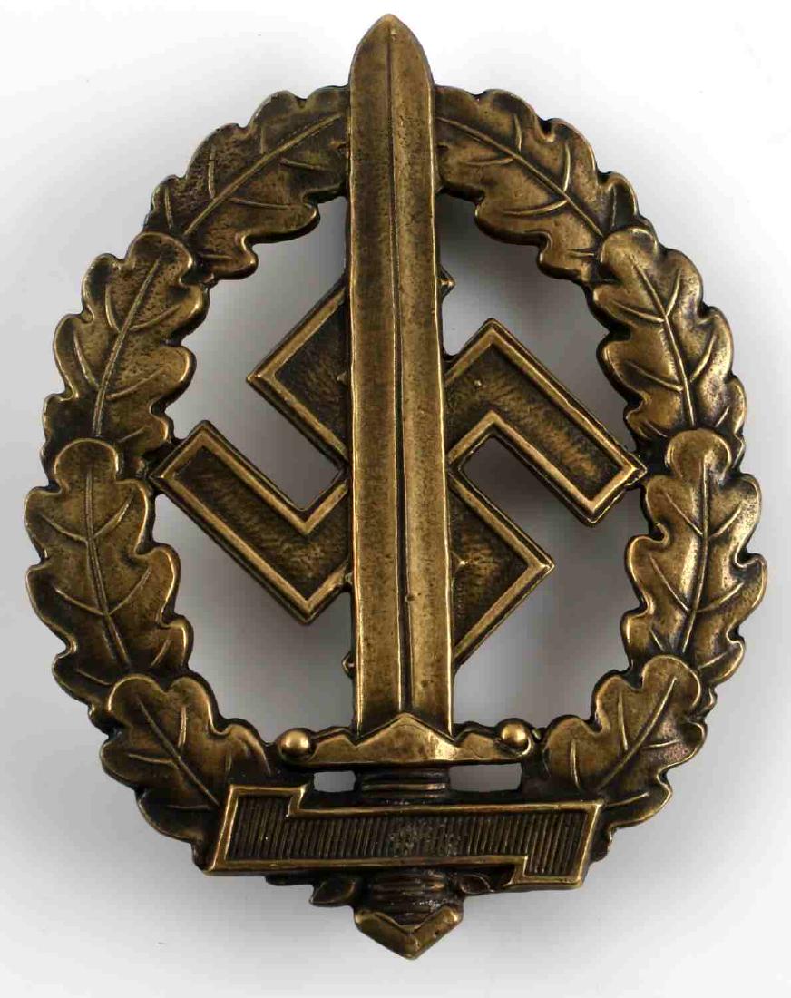 WWII GERMAN THIRD REICH BRONZE SA SPORT BADGE: Bronze SA War Wounded Sports Badge. Marked 'M1/52' on the back. Bronze construction. Unauthenticated/Sold 'as is'