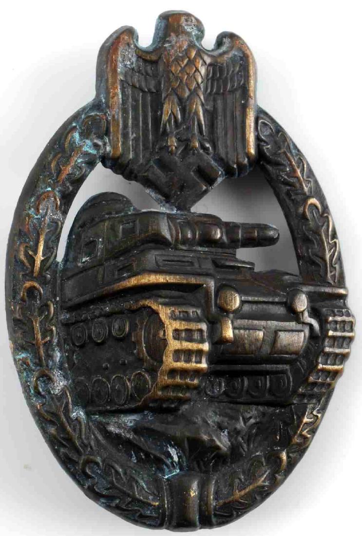 WWII GERMAN BRONZE TANK PANZER ASSAULT BADGE: German Panzer Assault Badge in bronze. Thin vertical pin back with a "C" catch. Stamped bronze construction. Awarded for three combat encounters. Very good condition overall with some patina, and smal
