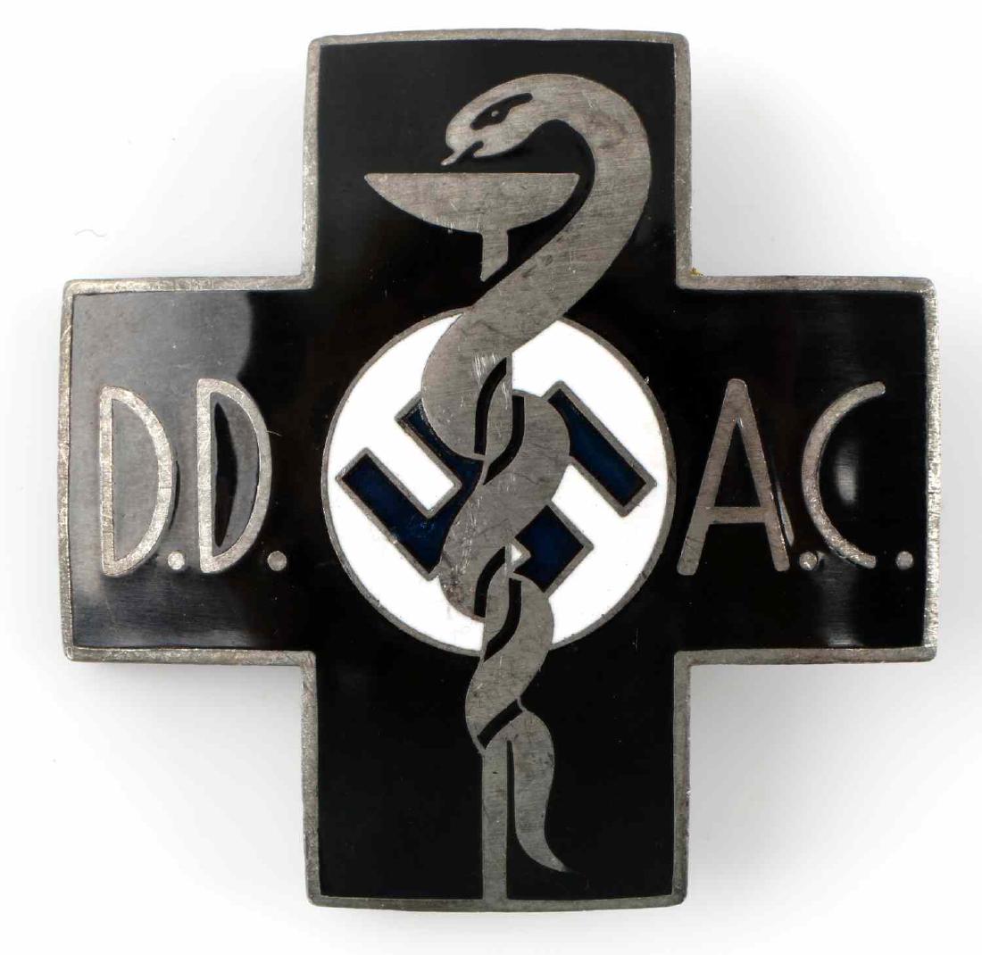 WWII GERMAN MEDICAL DD AC DOCTORS BREAST BADGE: Black enamel over nickel construction. Displays snake wrapped around beaker. DD to left, AC to the right. Reverse marked 'Carl Poellath Schrobenhausen.' Also numbered 25 to back bottom. Vertical safet