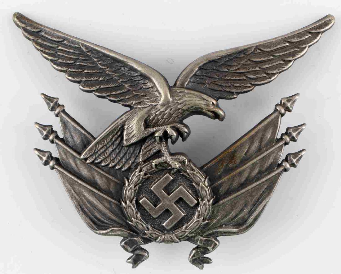 WWII GERMAN THIRD REICH LUFTWAFFE GORGET EAGLE: Reichsadler and flag emblem off of a Luftwaffe standard bearer's gorget. 3 1/2 inches wide by 2 1/2 inches tall. One piece stamped nickel construction.