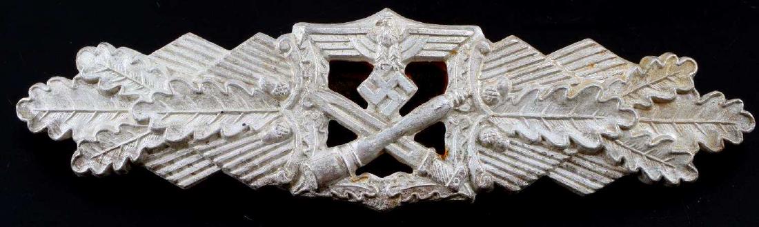 GERMAN THIRD REICH WWII ARMY CLOSE COMBAT CLASP: German WWII Army silver close combat clasp. The front shows a crossed potato masher stick grenade and bayonet with a German eagle above in the center. All three are flanked by a set of oak leaves on e
