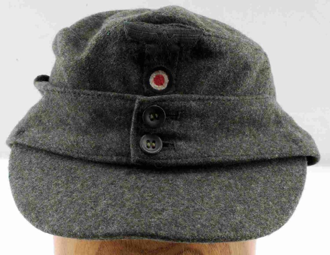 WWII GERMAN THIRD REICH ARMY M43 FIELD CAP: German Army M43 field cap. Army Bevo cloth Reichsadler and cockade patch. Medium size. Very good condition.