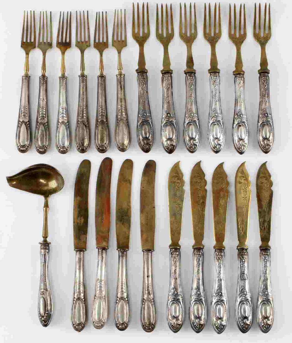 22 PIECE 800 SILVER FLATWARE SET SOLINGEN ARGON: 22 piece silverware set. 800 silver handles. Brass utensil. 6 Argon forks and 5 Argon knives. Forks measures 7 inches long and knives are 7.75 inches long. 6 Solingen forks measuring 6.75 inches. 4 So