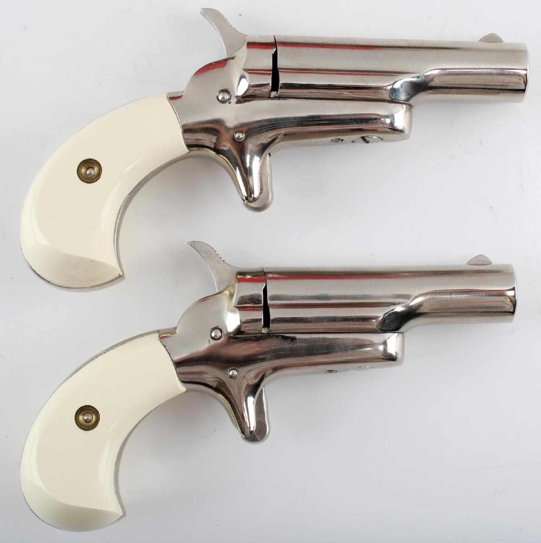 COLT CASED .22 CAL SHORT DERRINGER PISTOL SET: Case with a pair of Colt .22 short Derringer-style pistols in it. Case appears as a book with 'A Limited Edition' on the outside. Both pistols have a faux-ivorine grip and a fine nickel finish. Both a