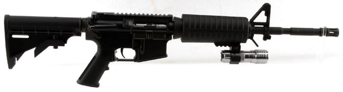 COLT M4 CARBINE .22 LR CAL RIFLE W EXTEND STOCK: All black steel and polymer construction, 17.5 inch barrel with muzzle break, bright clean bore, clear markings, flashlight below and collapsible stock. No magazine included. Very good condition. Requ