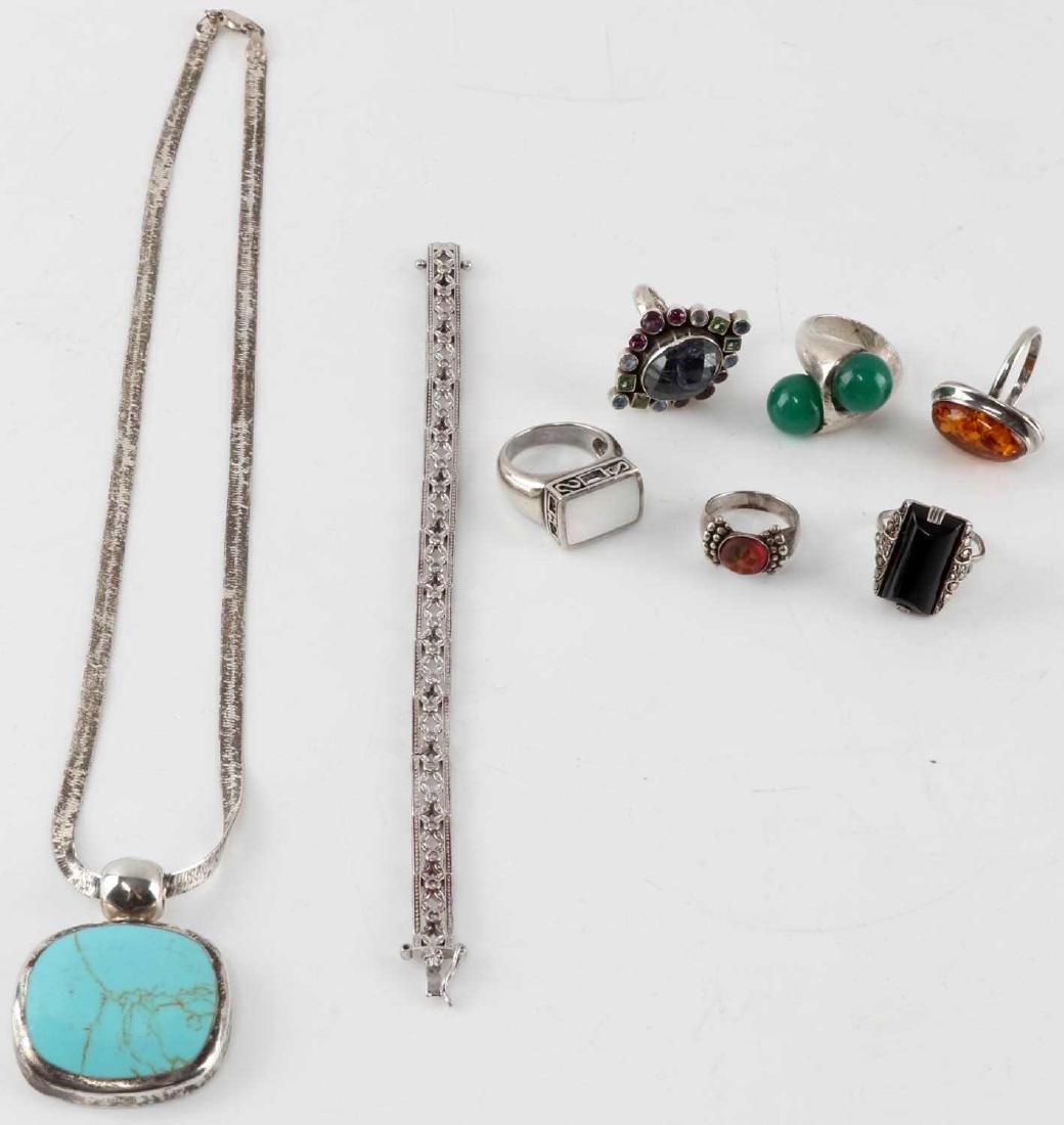 VINTAGE AND ANTIQUE SILVER RINGS NECKLACE BRACELET: Lot of vintage and antique silver jewelry. One marcasite bracelet. Measures 7.5 inches in length. Ring with jade green studs size 8.5. Ring with mother of pear inlay size 9. Ring with clay design inla
