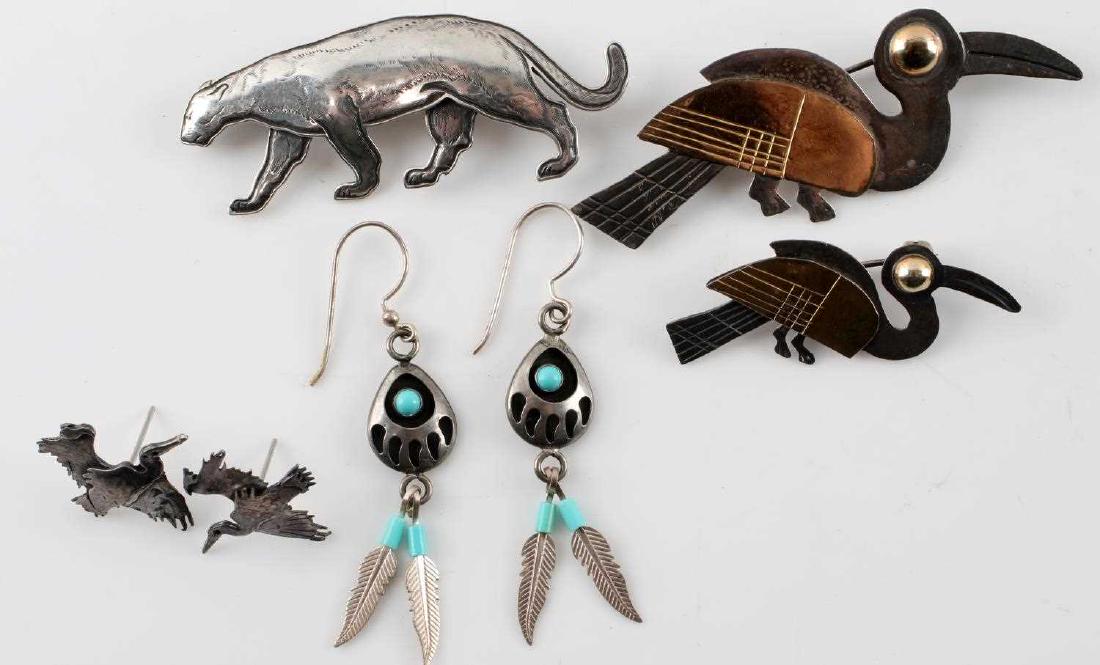 STERLING & 14K JEWELRY LOT KIT CARSON PANTHER: Includes a signed Kit Carson Mountain lion 2 1/4 inch brooch, Mexican silver and 14 K gold bird brooches 1 1/2 and 2 1/2 inches, USA stamped Native American earrings and heron earrings.