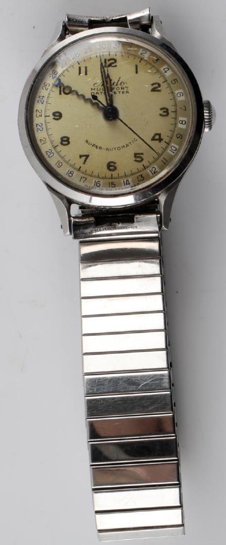 WORKING STAINLESS STEEL MEN MIDO WRISTWATCH: Stainless steel MIDO multifort superautomatic datometer working wristwatch. 7 inch circumference. Some very light scratches on watch face but otherwise in very good condition.