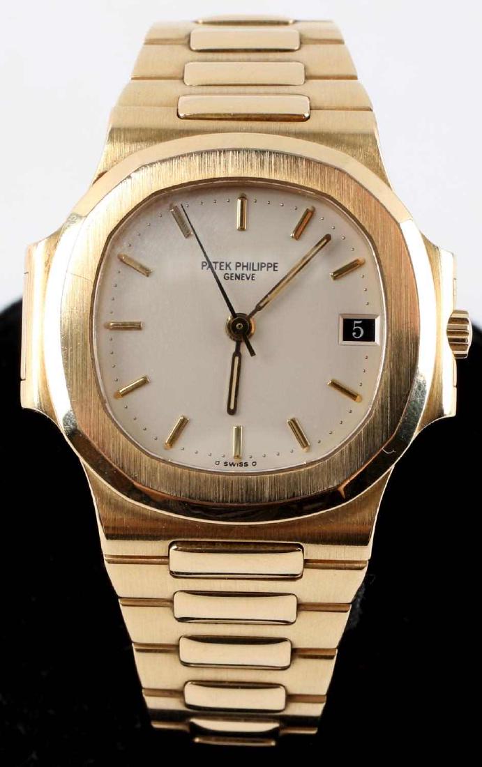 PATEK PHILIPPE 3800/01 18K MENS NAUTILUS WATCH: Patek Philippe 3800 Nautilus 18K yellow gold with yellow gold bracelet with 18k white gold clasp. Automatic caliber 335 SC movement, date window at 3 o'clock, centered sweep second hand, diameter 37mm