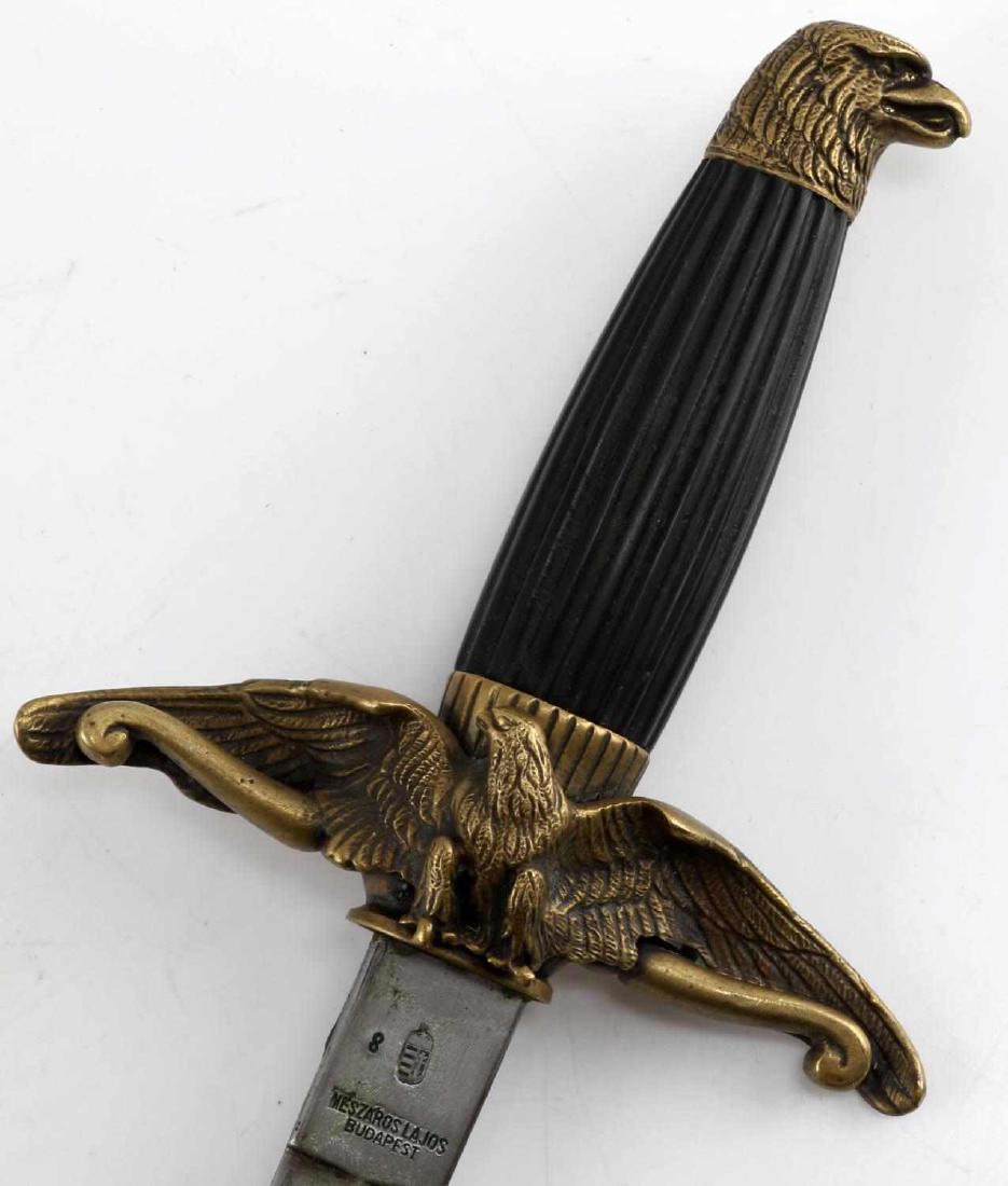 WWII ROYAL HUNGARIAN AIR FORCE DRESS DAGGER: WWII Royal Hungarian Air Force dagger. double edged blade with etched designs (featuring crown and cross of Lorraine) and the date 1944. Ribbed Bakelite handle, and brass fittings including eagle head