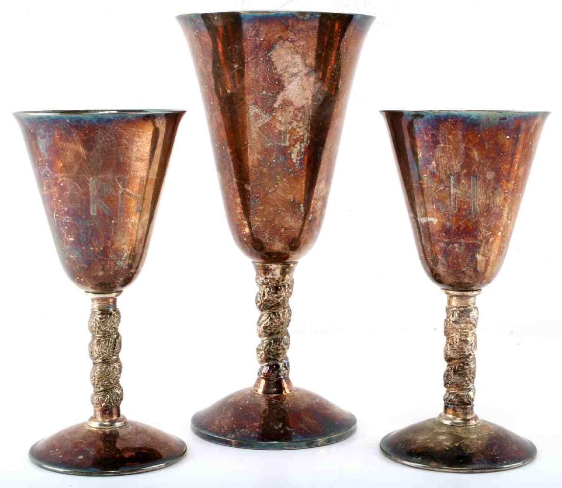 WWII GERMAN REINHARD HEYDRICH SILVER WINE GLASSES: Three silver glasses with Third Reich leader Heydrich's initials etched to front. Small ones measure 5.5 inches tall. The larger one measures 7 1/8 inches tall. All pieces marked with hallmark (800, c