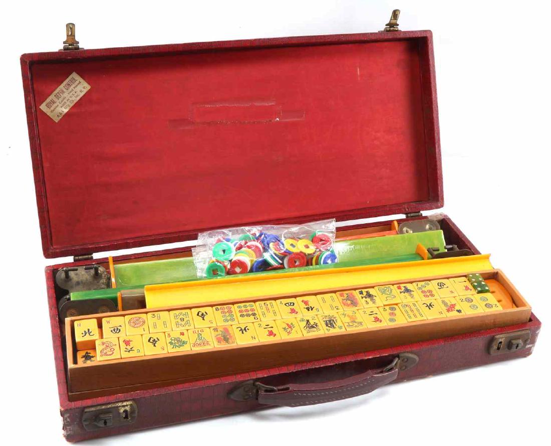 ANTIQUE CATALIN BAKELITE MAHJONG SET W ORIGINAL: Antique Catalin / Bakelite Mahjong Set with original red leather case from the original manufacturer. Set includes : 2 carriers for the 136 Mahjong tiles made out of Catalin Bakelite, bag of central h