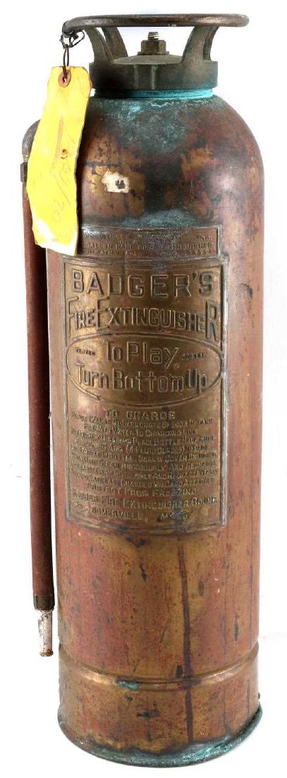 ANTIQUE BRASS BADGER FIRE EXTINGUISHER: Antique brass Badger's Fire Extinguisher. Measures 24 inches in height. In very good condition. Some tarnish. CAT12