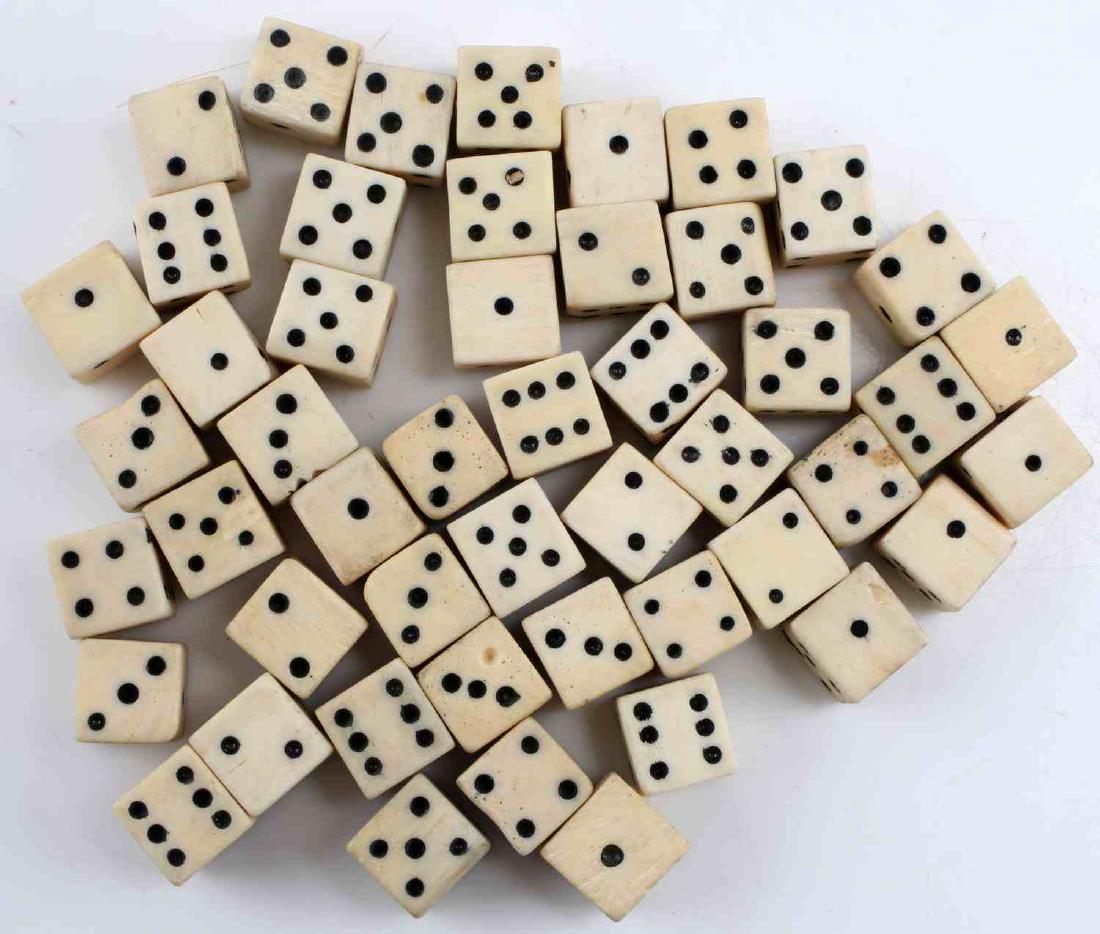 49 HAND MADE MINATURE ANTIQUE BONE GAMBLING DICE: 3/8" Antique Hand made Bone Gambling Dice. Good condition for their age, however signs of use are present including signs of abrasions.