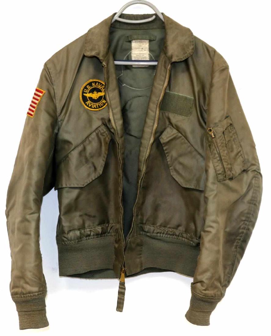 VIETNAM US NAVY FLYERS JACKET W PATCHES SIZE 42: US Navy Aviation patch to right breast, flag patch to right arm and 5 patches to back. Very good condition. Label has worn off. Appears to be about size 42.