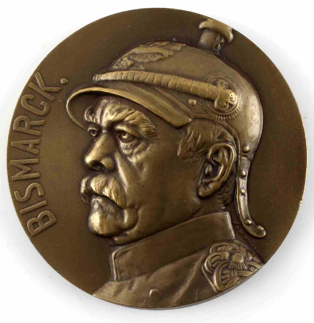 IMPERIAL GERMAN PRE-WAR CHANCELLOR BISMARCK AWARD: Imperial German Pre World War I Chancellor Otto Von Bismarck table award. Item measures 2 3/8" in diameter. The front of the award shows Bismarck wearing a Prussian officers spike helmet. Die struck b