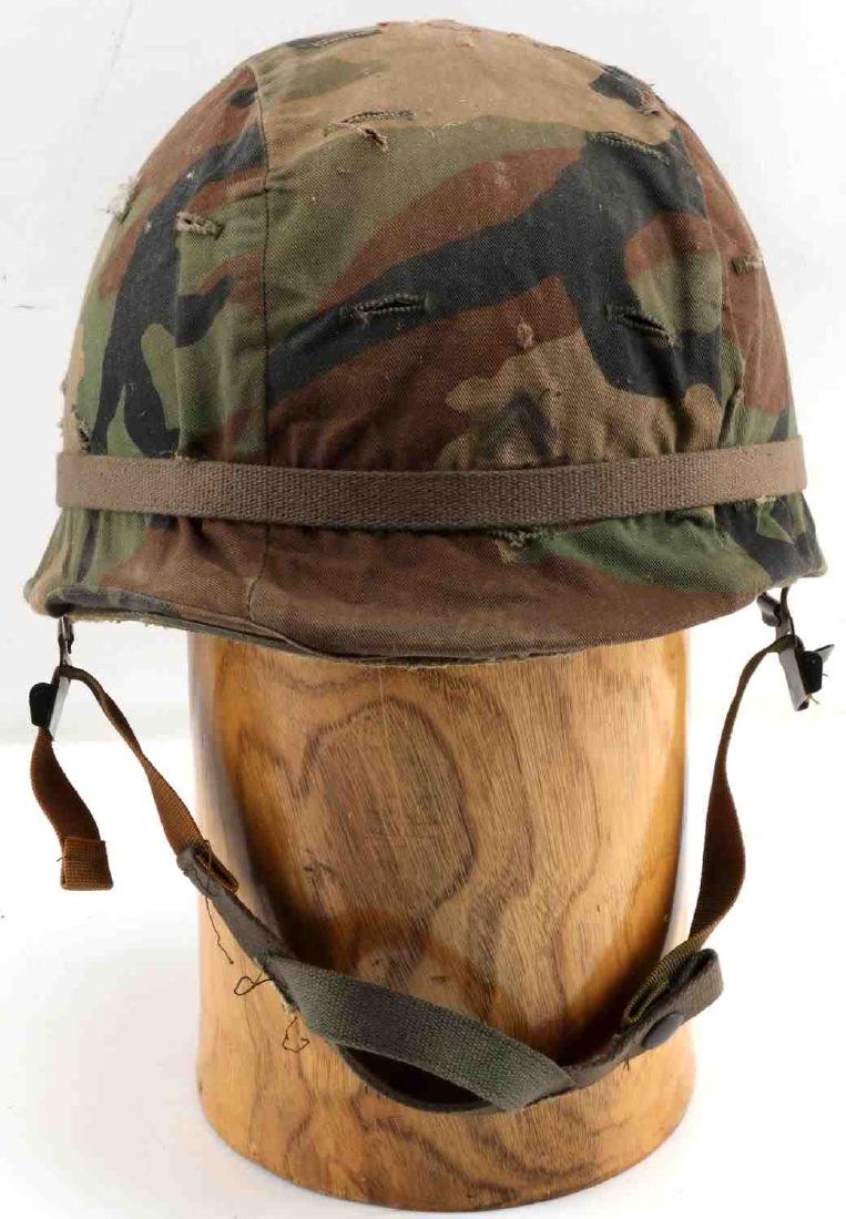 US MILITARY M1 HELMET W CAMO COVER AND LINER: Camo cover over helmet. Liner is affixed to helmet. Measures 9.5 inches along interior. Very good condition.