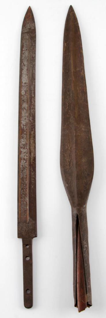 2 BLADES BELGIAN 1889 MAUSER BAYONET & SPEARHEAD: Spearhead measures 19 3/8 inches with 14 double fuller blade, some wood still stuck in end. Lot also includes an 1889 Belgian bayonet blade by Hopkins & Allen, U.S.A. with 15.75 inch blade. Heavy oxid