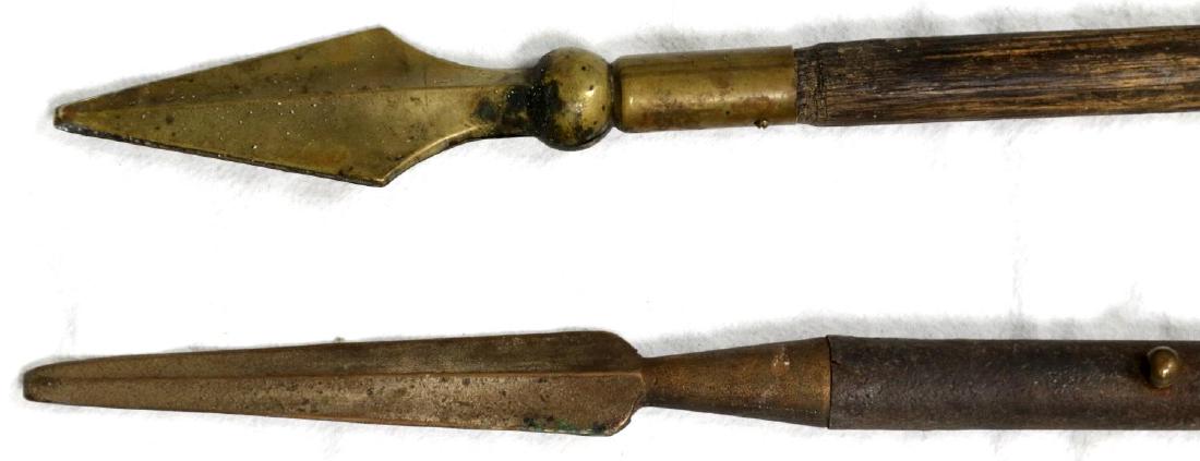 ANTIQUE DOUBLE HEAD SPEAR PIKE & BROADHEAD: Well crafted double and twisted pike like spear measuring 80 inches, well crafted , balanced and meant for business and a brass and iron broad head spear measuring 52 inches. g3