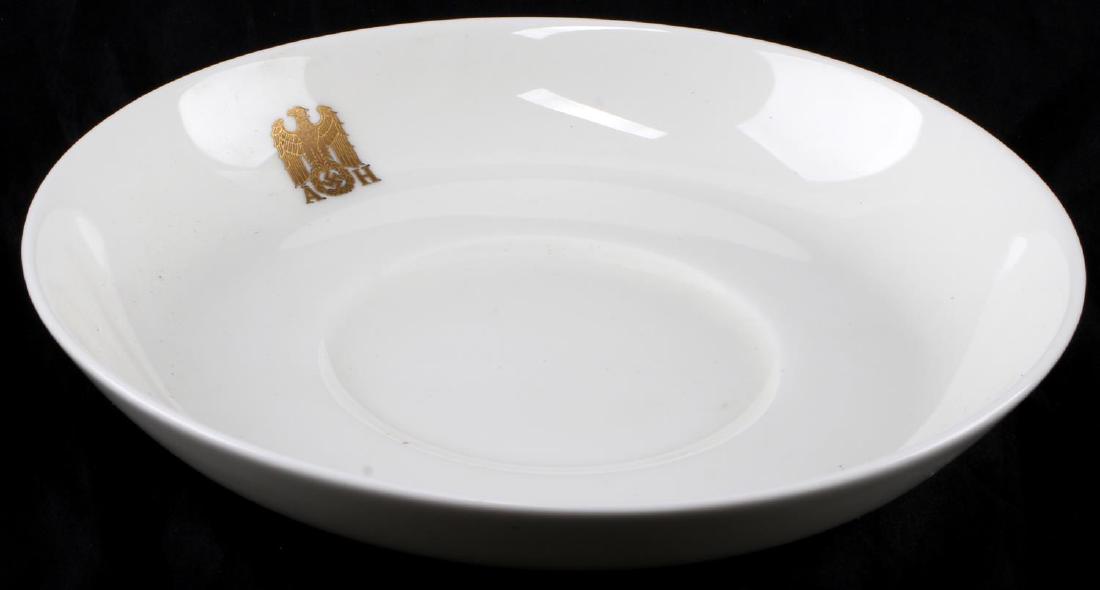 GERMAN THIRD REICH HITLER ALLACH PORCELAIN SAUCER: Porcelain cup saucer with the gold 'AH' maker mark of Hitler's formal set. Has Allach maker mark on the bottom. Brought to the US by a member of the 506th PIR. Measures 6 inches in diameter. In very g