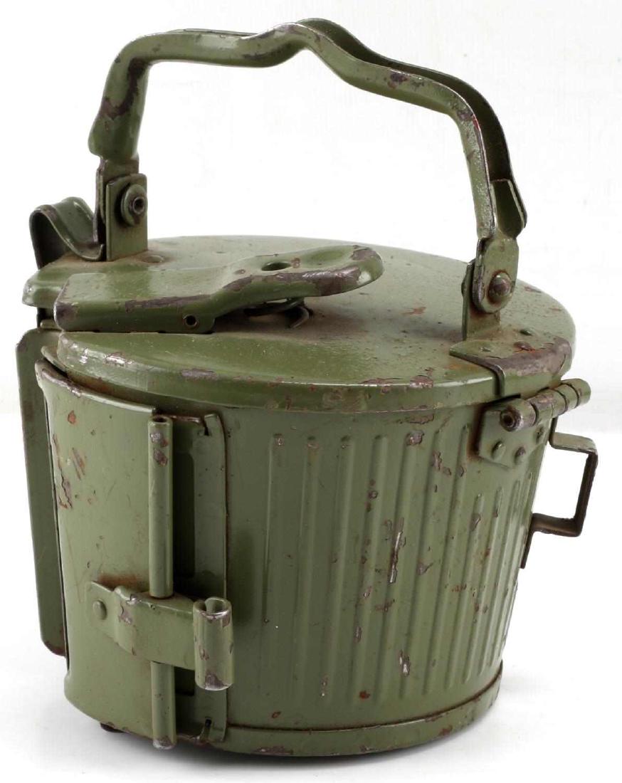 WWII GERMAN THIRD REICH MG42 MACHINE GUN DRUM: Drum belt carrier for an MG42 from the WWII period. Painted green metal with slight paint wear in some areas. In very good condition overall.