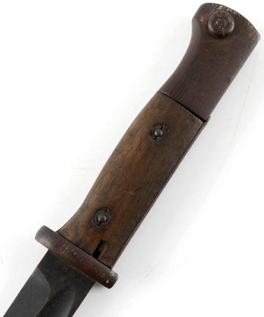 WWII GERMAN THIRD REICH 98K MAUSER BAYONET: German Mauser bayonet. Numbered on obverse blade ricasso "WKC" and "2953 f." Scabbard is marked "44asw" and "2569." Very good condition overall. This item has a reserve.