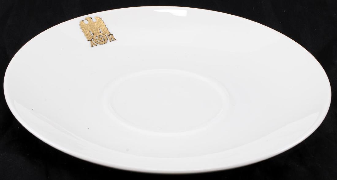 GERMAN THIRD REICH HITLER ALLACH PORCELAIN SAUCER: Porcelain cup saucer with the gold 'AH' maker mark of Hitler's formal set. Has Allach maker mark on the bottom. Brought to the US by a member of the 506th PIR. Measures 7 inches in diameter. In very g