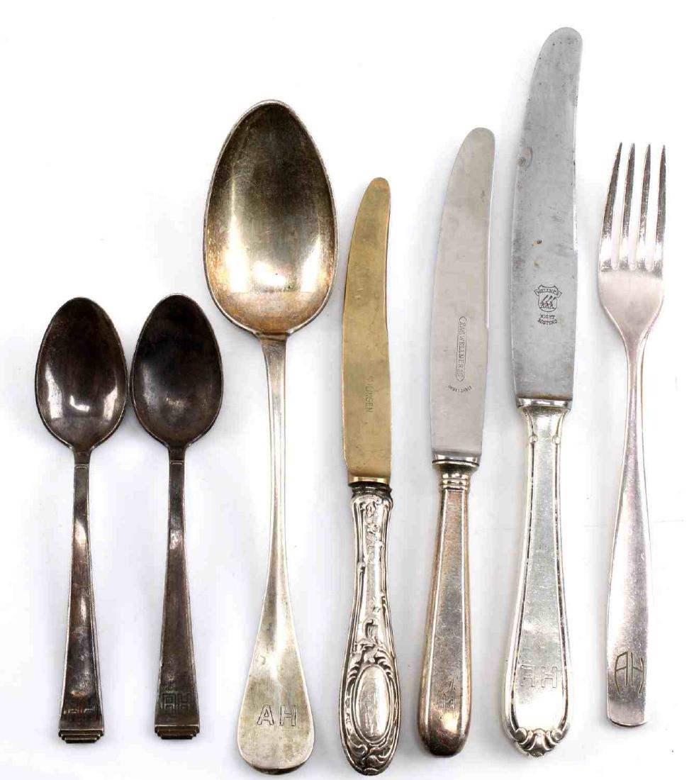 WWII GERMAN ADOLF HITLER MONOGRAM SILVERWARE LOT: This lot includes 7 pieces of silverware from the personal collection of Adolf Hitler. Silverware has A H monograms, is hallmarked 90 silver, and have either Wellner or Solingen marks. 1 spoon is unma