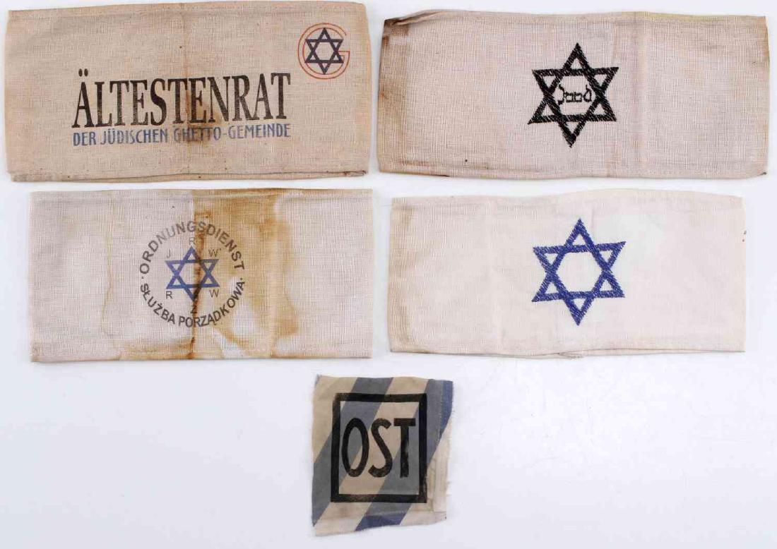 GERMAN WWII THIRD REICH HOLOCAUST ARMBAND LOT: German WWII Third Reich Holocaust Period Armbands, with "OST" KZ patch. Includes Star of David band, Dutch Star of David band, Warsaw Ghetto Police band, and Ghetto Council of Elders badge. Some stain