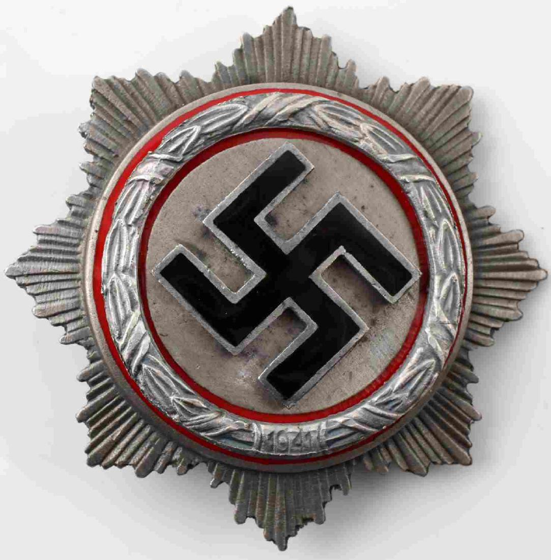 GERMAN WWII THIRD REICH GERMAN CROSS IN SILVER: German WWII Third Reich German Cross in Silver. Measures 2 3/4 inches in diameter. Reverse is maker marked "G Brehmer Mark Euicir". Very good condition. Unauthenticated. Sold "As Is". This item has a
