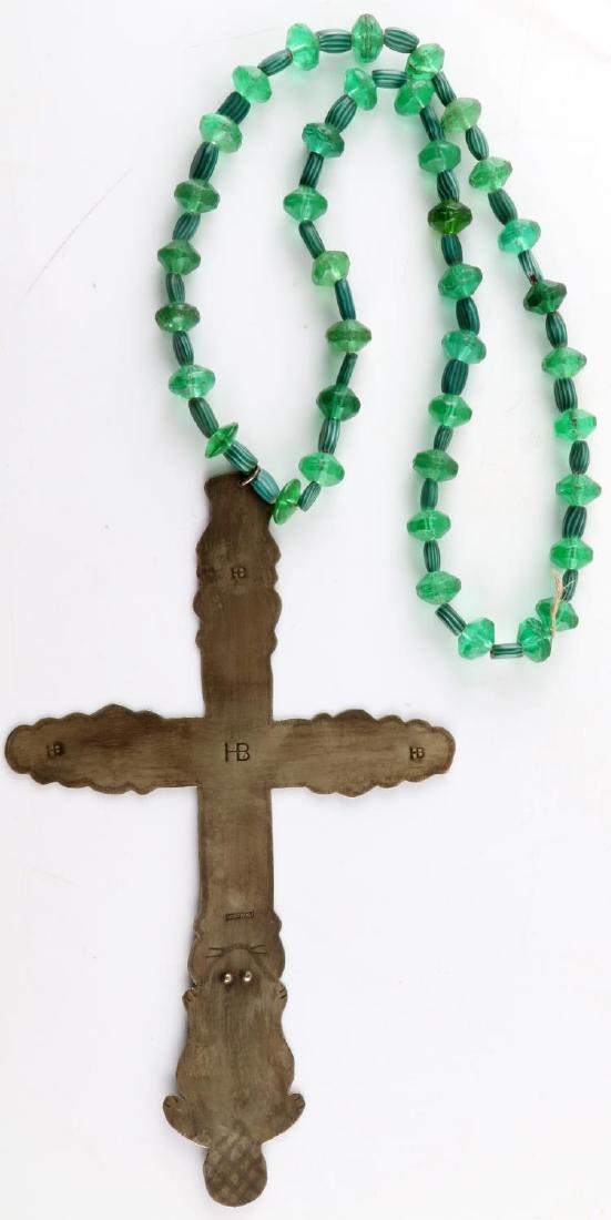 HUDSON BAY COIN SILVER TRADE CROSS FUR TRADE BEADS: Hudson Bay coin silver trade cross. Has period green fur trade beads attached. Cross is stamped with filigree design throughout and with HB in in four places. Stamped Montreal at bottom. Bottom is in 