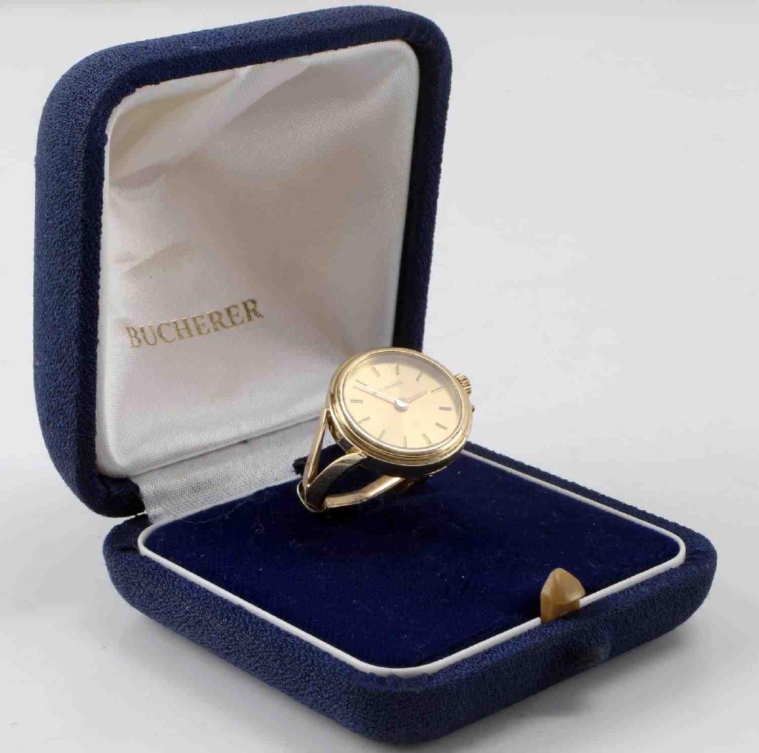 BUCHERER 14K GOLD RING WATCH IN BOX: 14k gold Bucherer rink watch with box. Measures 14 mm in diameter and weighs 7.7 grams in total. This lot has a reserve.